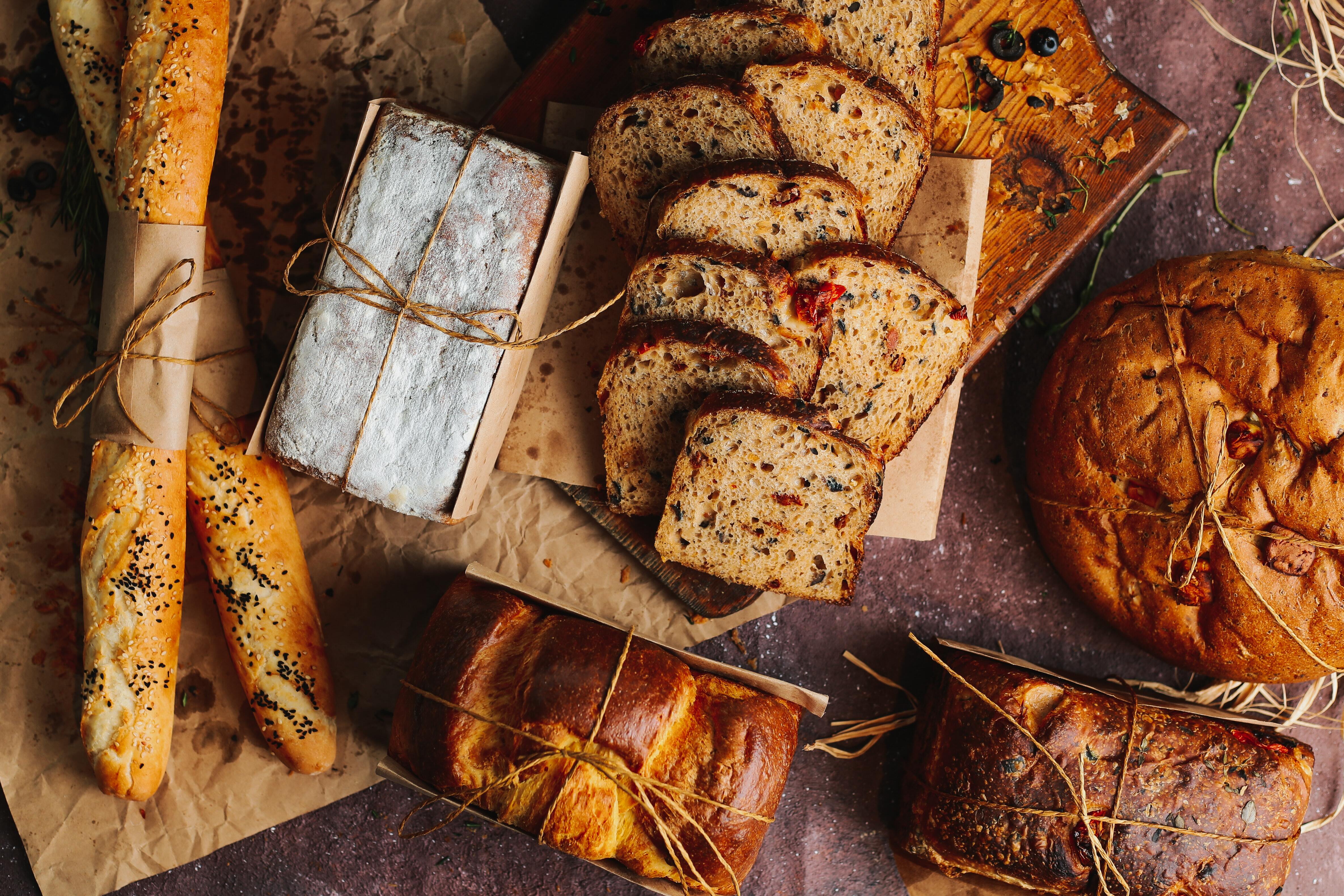 A table with an assortment of bread and baked goods